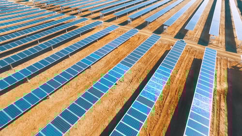 Aerial View of Solar Panels in Rural Landscape
