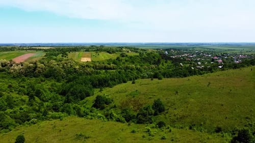 Aerial drone view of a flying over the rural agricultural landscape.