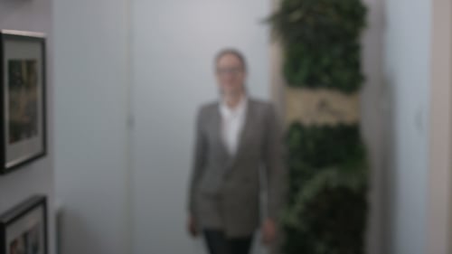 Young Businesswoman Walking Close To the Camera