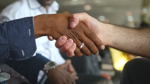 Multiracial Handshake at Office. Business Men Greeting Each Other in Airport Terminal. Shaking of