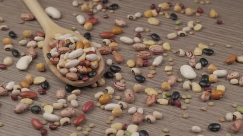 Dry Mixed Beans in Wooden Spoon Close Up