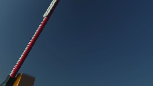 Closing Barrier Gate with CHECKPOINT Sign