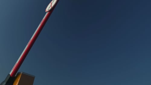 Closing Barrier Gate with NO ABUSE Sign