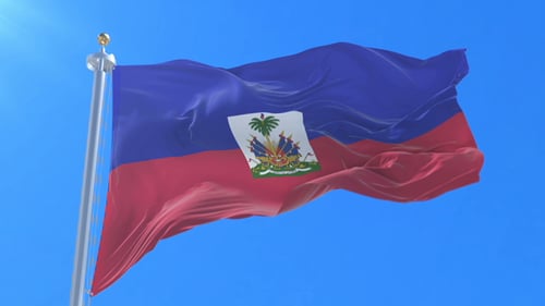Haiti Flag Waving on Pole Against Blue Sky