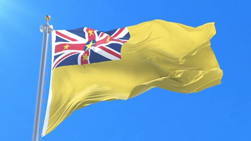 Realistic Niue Flag Waving Against a Clear Blue Sky