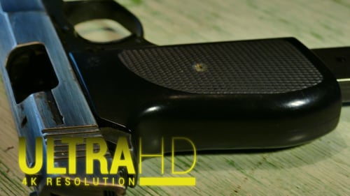 Close Up of Pistol on a Green Table