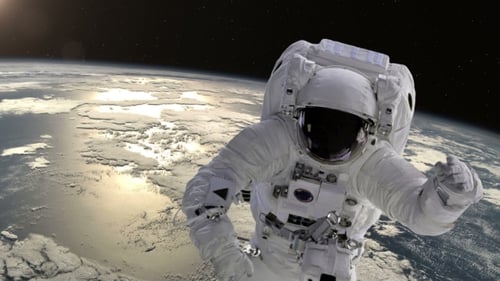 Astronaut Floating Above Earth in Space