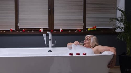 Senior Woman Relaxing in Luxurious Bubble Bath