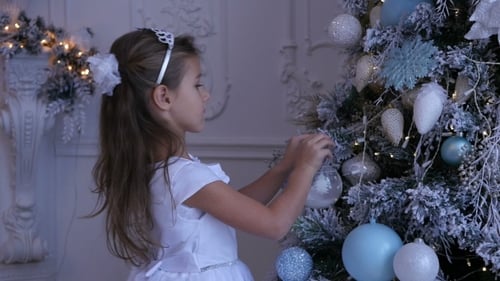 Girl Decorating Christmas Tree with Ornaments