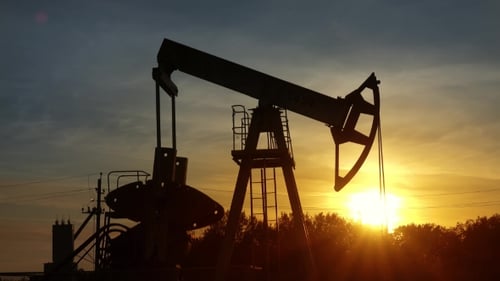 Oil Pump Jack Silhouette at Sunrise
