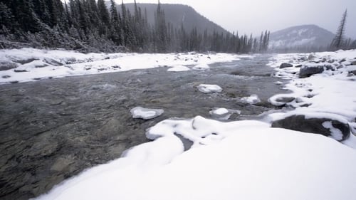 Icy Winter River in Snowstorm