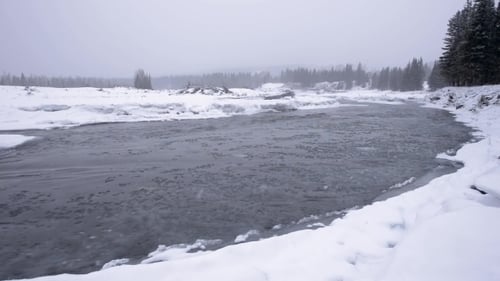Icy Winter River in Snowstorm