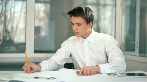 Attractive Engineer Architect Working in Office