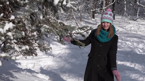 Girl Having Fun with Snow Tree