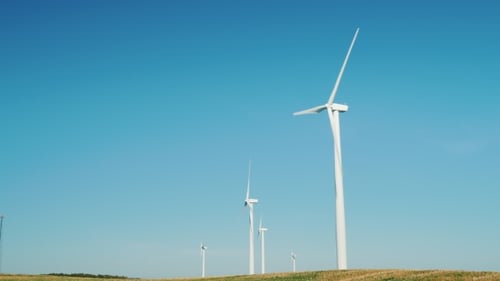Several Wind Generators Against the Blue Sky