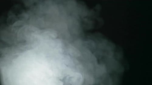 Abstract Billowing White Smoke on a Black Backdrop