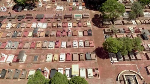 Small cemetery with grid layout - top down view. Alleys between blocks of tombs in a graveyard