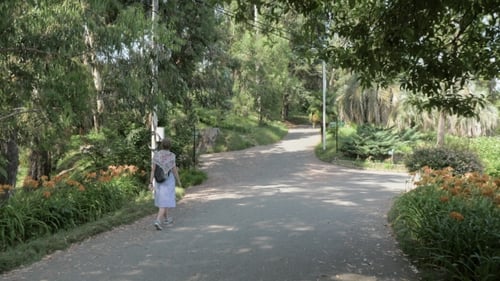 Young Girl Walking in Tropical Botanical Garden. Batumi, Georgia