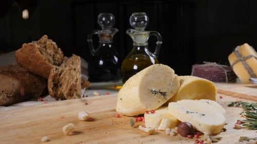 Restaurant Concept. Table Setting. Sliced Hard Cheeese Put on Wooden Background with Home Made Bread
