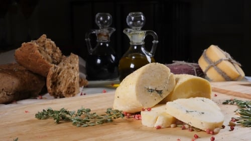 Restaurant Concept. Table Setting. Sliced Hard Cheeese Put on Wooden Background with Home Made Bread