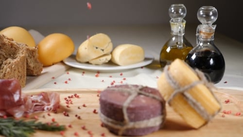 Restaurant Concept. Table Setting. Two Pieces of Cheeese Decorated with Rope Are on Wooden