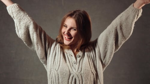 Happy Woman Cheering and Giving Thumbs Up