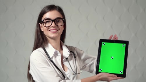 Smiling Woman Doctor Holding Tablet Chroma Key