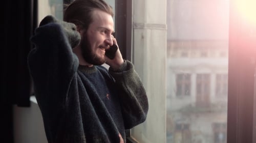 Boy with Phone By Window