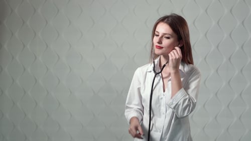 Young Doctor with Stethoscope Smiling Confidently