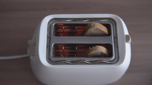Toaster Making Toast in Kitchen at Daytime