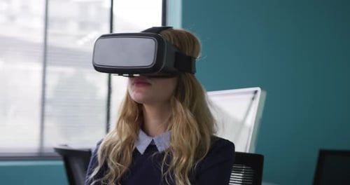 Woman Uses VR Headset in Modern Office