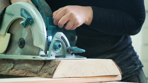 Cutting Wood with a Power Saw Close Up