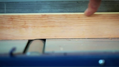 Carpenter Engaged in Woodworking. The Joiner Works with the Tree