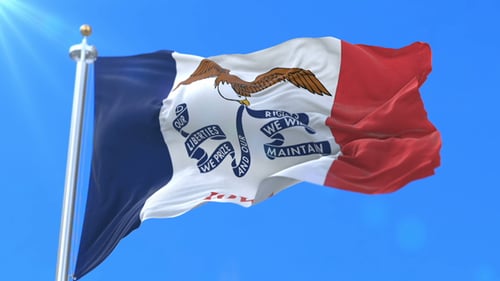 Iowa State Flag Waving Against Clear Blue Sky