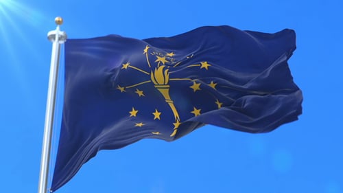 Indiana State Flag Waving Against Bright Blue Sky