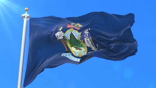 Maine State Flag Waving with Coat of Arms in Blue Sky