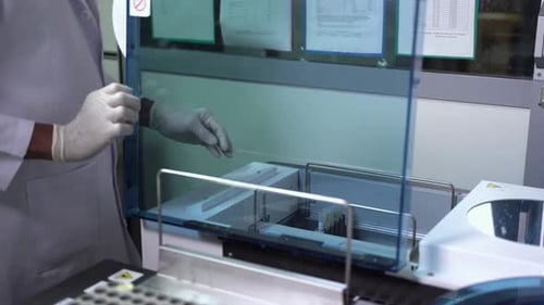 Medical Lab Loading Samples Into The Machine