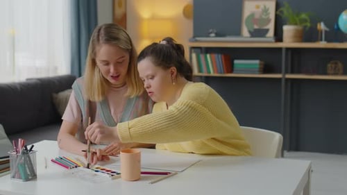 Two Women Painting Together at Home at Table