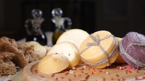 Restaurant Concept. Table Setting. Sliced Hard Cheeese Put on Wooden Background with Home Made Bread