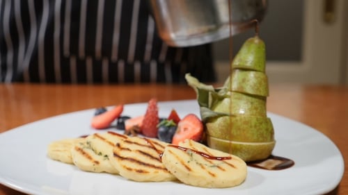 Final Touch Concept. Restaurant Concept. White Plate Decorated with Berries and Sliced Pear. of Che