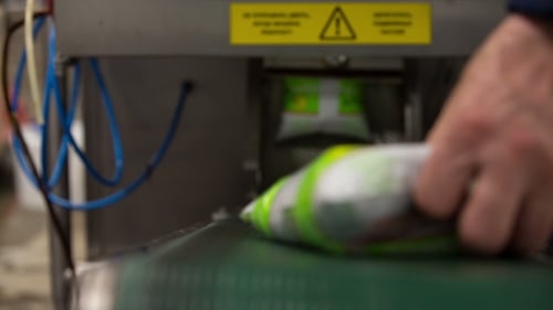 Packaged Food on Conveyor Belt in Factory