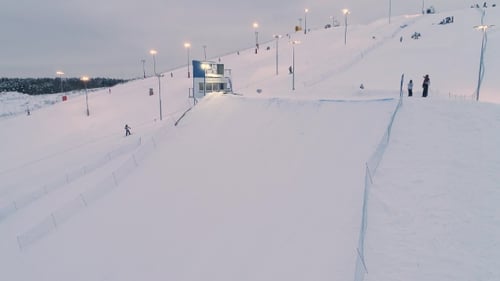 Skiing and Snowboarding on a Snowy Mountain