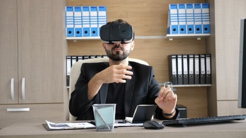 VR Technology - Young Businessman in the Office Wearing Virtual Reality VR Headset