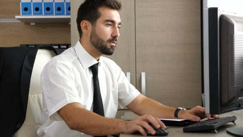 Young Businessman Relaxing In The Office With Feet On The Table