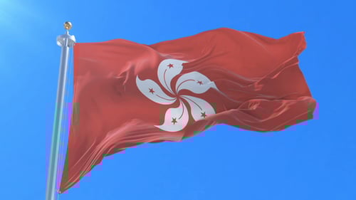 Hong Kong National Flag Waving in Bright Blue Sky