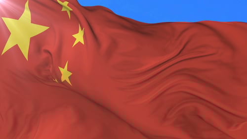 Realistic Waving Flag of China on Blue Sky Background