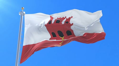 Realistic Gibraltar Flag Waving on Flagpole Against Blue Sky