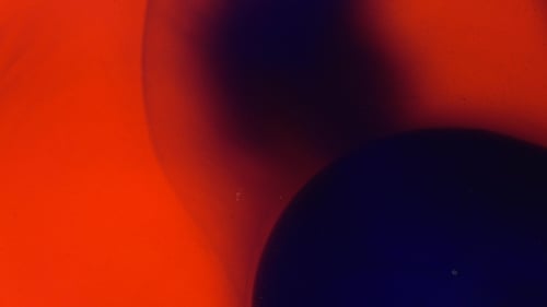 Dynamic Abstract Background with Blue Shapes on Orange