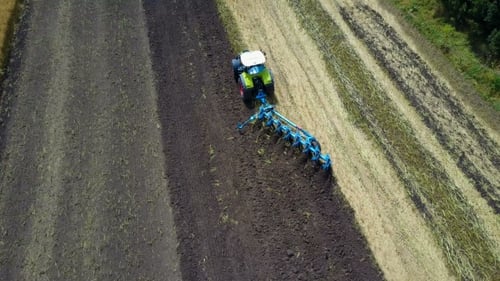 Tractor Working In The Agricultural Field