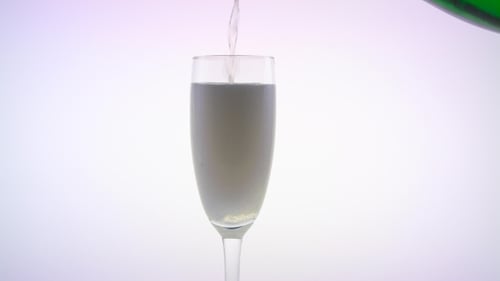 Champagne Pouring Into a Flute Glass